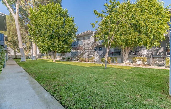 apartment community with grass and trees at BLVD Apartments LLC, Tarzana, CA 91356