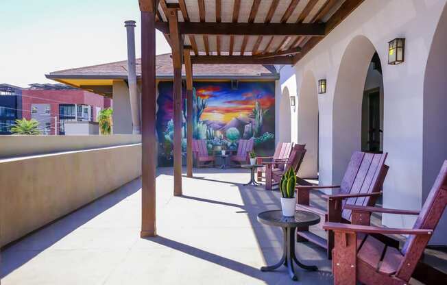 patio with covered lounging area at Roosevelt Square apartments