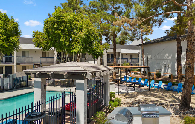 our apartments have a swimming pool with a gazebo and lounge chairs