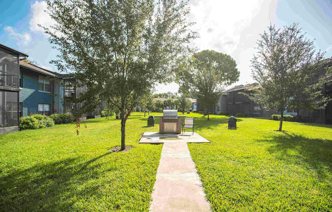 A small monument sits in the middle of a grassy area.