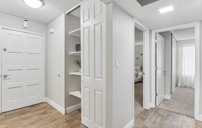 a renovated living room with white doors and a closet at Summerwood Apartments, California, 95050