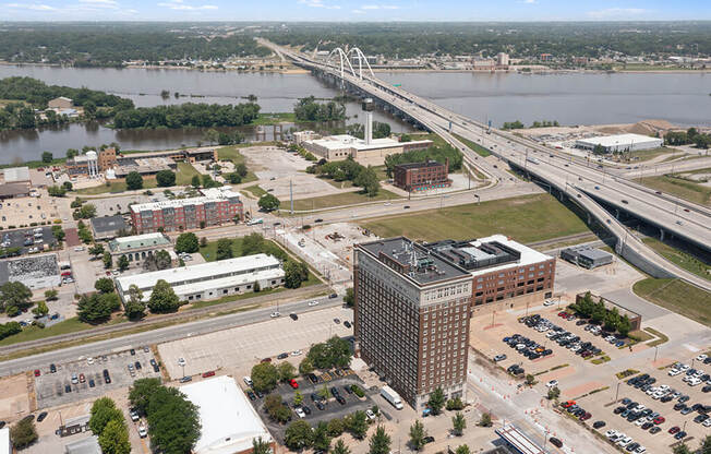 an aerial view of a city with a bridge over a river