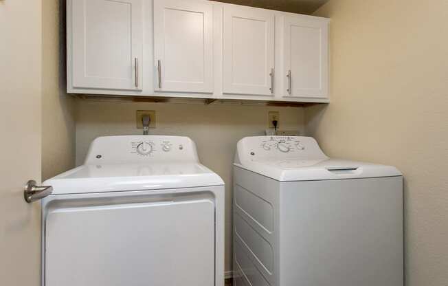 Washer & Dryer With Built-In Cabinets Above