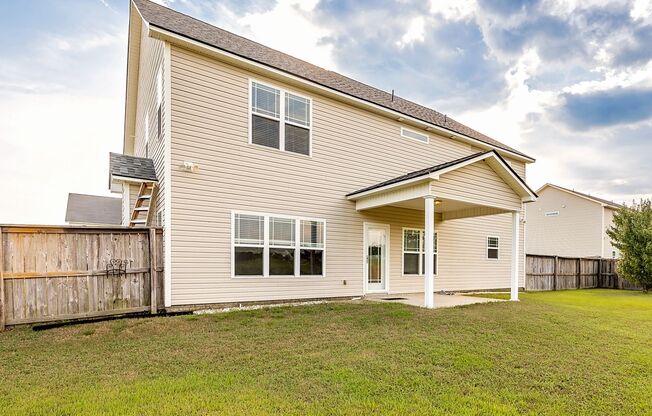 Welcome to this charming 4-bedroom, 3.5-bath home in Raeford