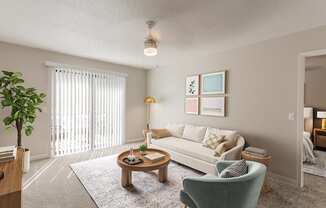A living room with a white couch, a green armchair, a wooden coffee table, and a potted plant.