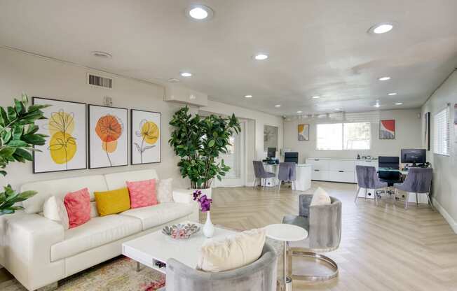 a living room filled with furniture and a large window