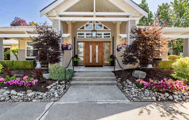 A house with a front yard and a stone pathway leading to the front door.