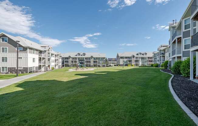 the preserve at ballantyne commons park with lawn and apartment buildings