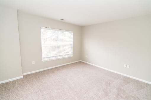 an empty room with a window and carpet at Merion Milford Apartment Homes, Milford, CT, 06460