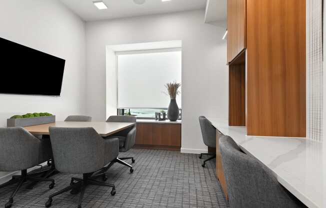 a conference room with a table and chairs