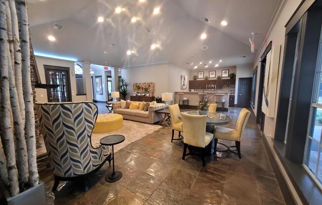 a living room filled with furniture and a fireplace