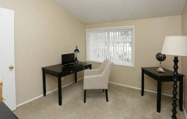 Additional bedroom with plush carpeting in townhome