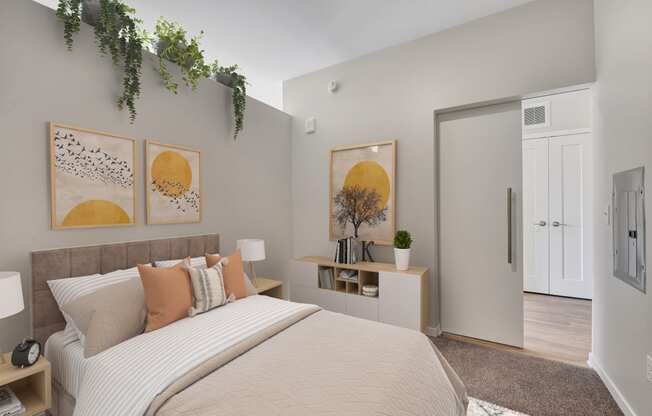 a bedroom with a large bed and a door to a bathroom