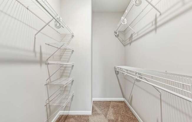 Empty white shelves in a room.