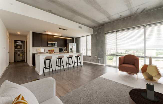 a living room and kitchen in a modern apartment