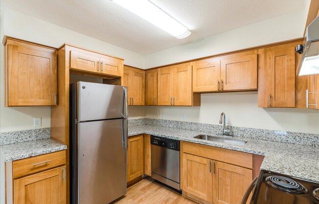 Cascade Woods kitchen area with fridge and dishwasher