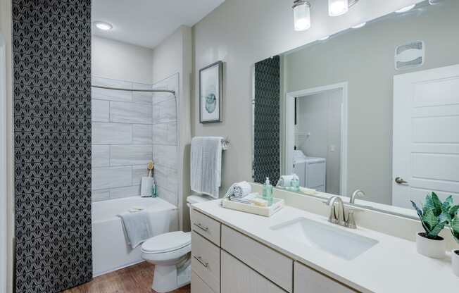 Modern Bathroom with Wood floors and quartz countertops at Bon Haven Apartments in Spartanburg, SC