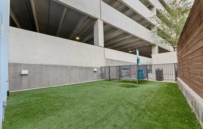 A green lawn in a parking garage.
