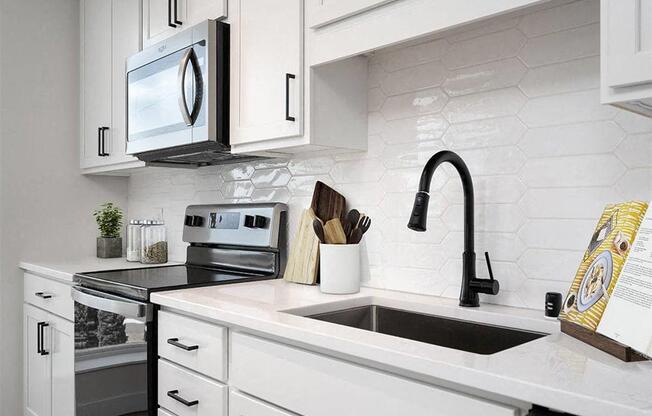 a kitchen with a sink and a microwave