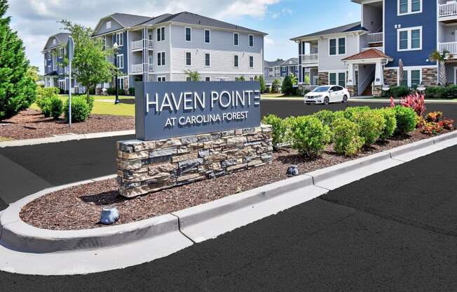 a sign that says haven pointe in front of a building