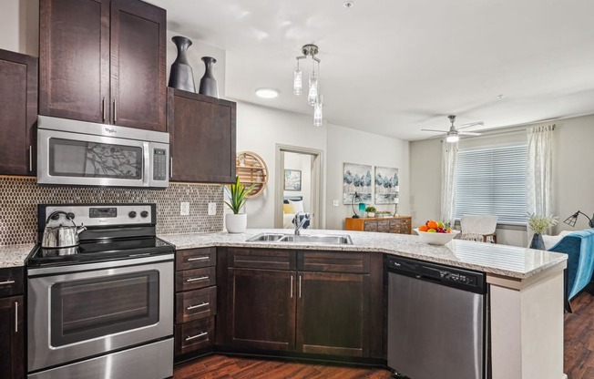 a kitchen with stainless steel appliances and wooden cabinets