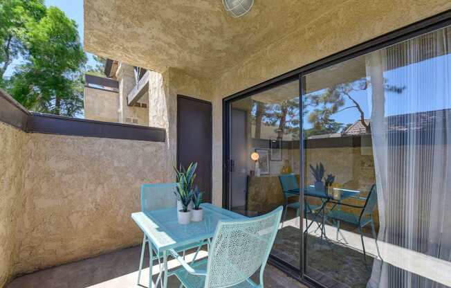 A patio with a table and chairs is shown.