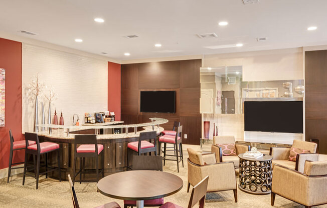 Resident lounge with bar area and seating; flat screen TVs; tables and chairs