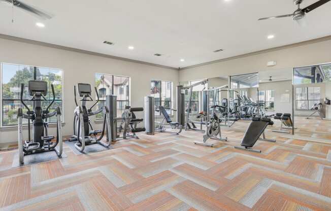 fitness center with weights and cardio equipment