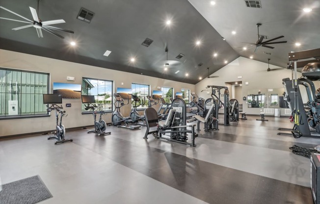 the gym is equipped with cardio equipment and weights at The Depot in The Depot Raymore, MO 64083