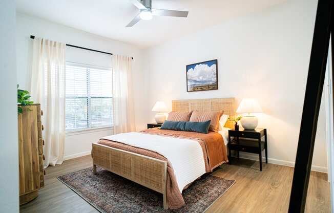 a bedroom with a bed and a window