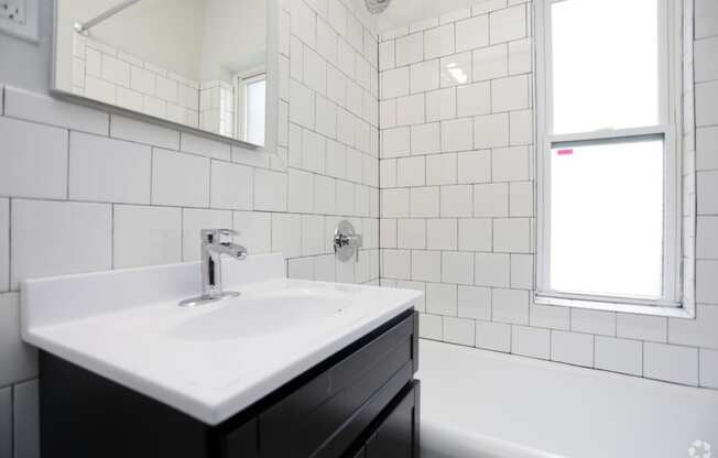 The Edison apartments bathroom with tile backsplash