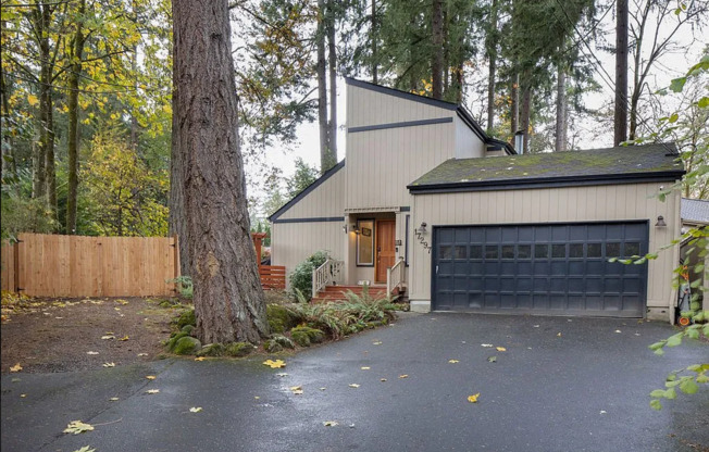 Check Out This Beautiful Home Nestled In The Trees That Sits On A Huge Lot In Lake Oswego!