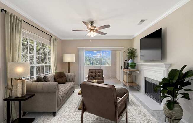 a living room with couches and chairs and a tv