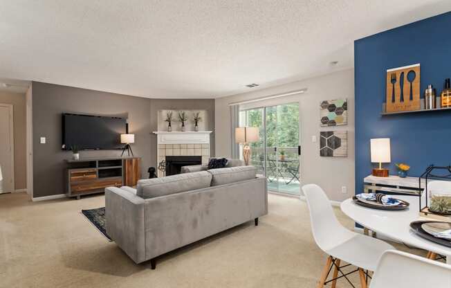 a living room with a couch and a table and a television