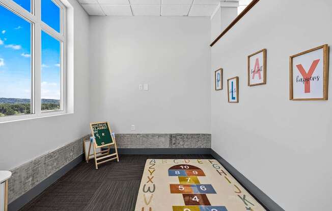 A room with a carpet and a mat on the floor with numbers and letters on it.
