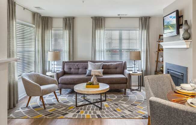Orchards Apartments Marlborough ma apartment loft style apartments photo of living room with fireplace and large windows and modern furniture