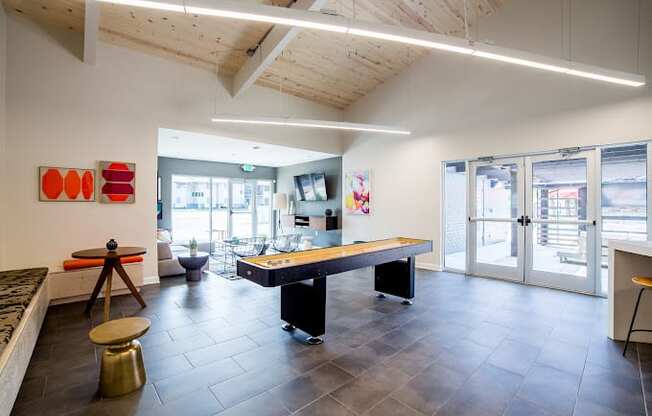 a games room with a ping pong table