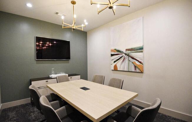 a conference room with a wooden table and chairs