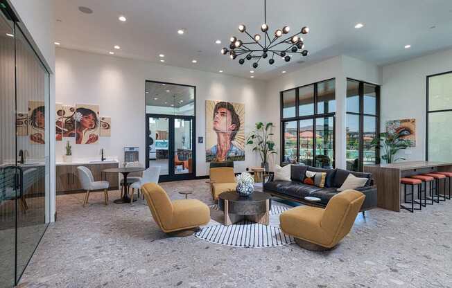 A modern living room with a yellow chair in the center.
