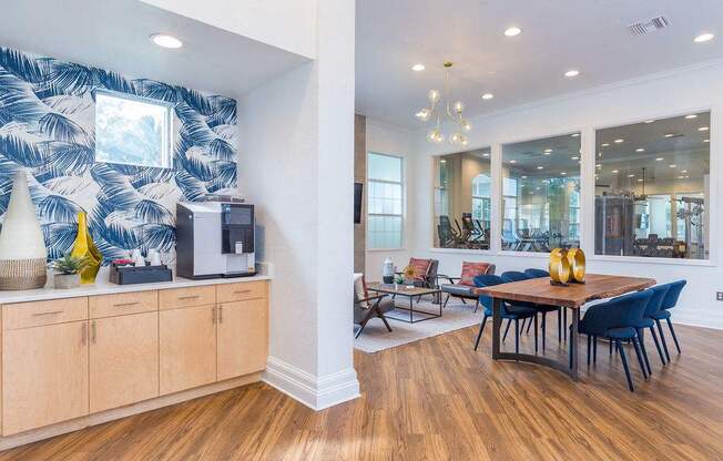 A dining room with a wooden table and chairs.