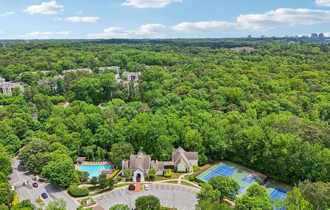 A bird's eye view of community with a swimming pool and tennis court.