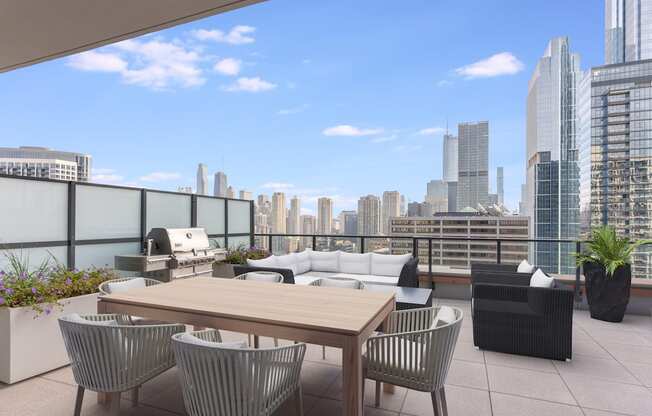 a terrace with a table and chairs overlooking a city at Cassidy on Canal, Chicago, 60606