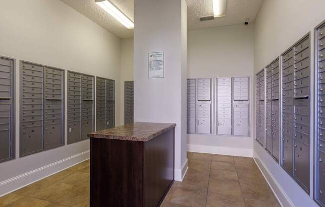 A room with a brown desk and filing cabinets.