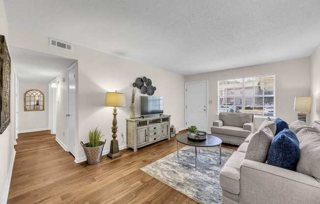 a living room with a couch and a tv