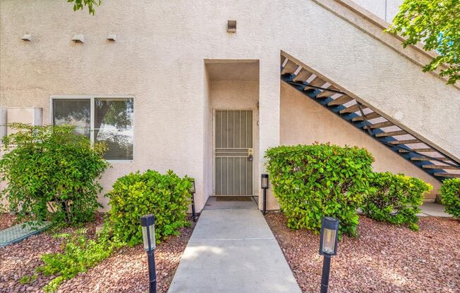 Charming 2-Bedroom First Floor Featuring Open Layout, Fireplace, Patio & Community Pool