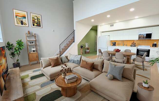 A living room with a couch, a coffee table, and a painting on the wall.