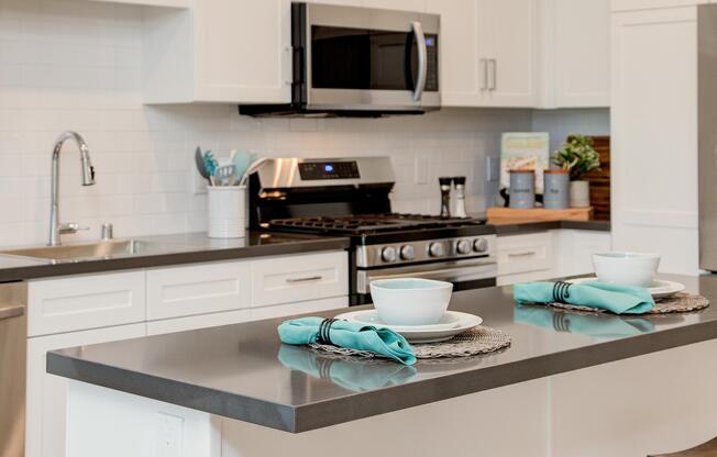 a kitchen with a sink and a microwave