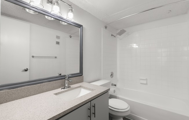 Bathroom with spacious vanity in an apartment on Coachman Rd in Clearwater, FL.