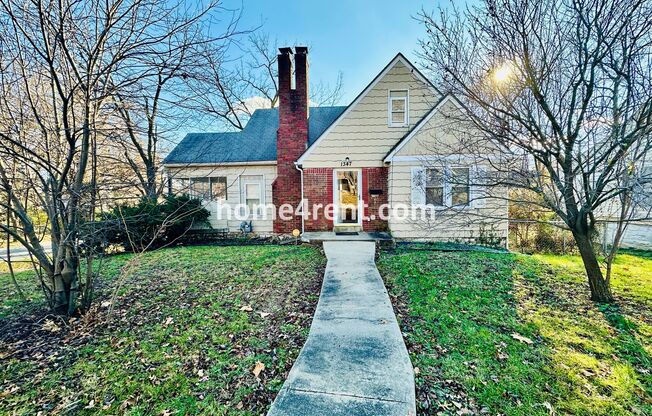 Adorable Home Featuring Wood Floors, SS Appliances, Updated Bathrooms and Plenty of Natural Light!