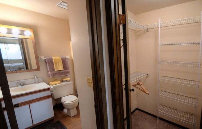 a bathroom with a toilet and a sink and a shower